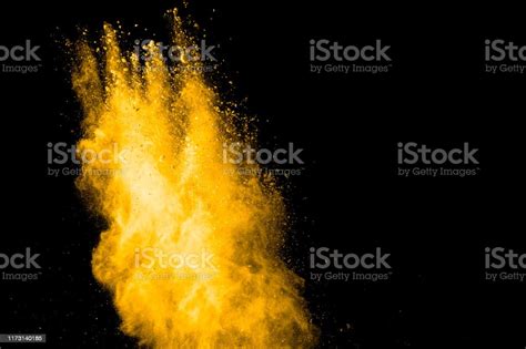 Yellow Dust Particles Explosion On Black Backgroundyellow Powder Dust