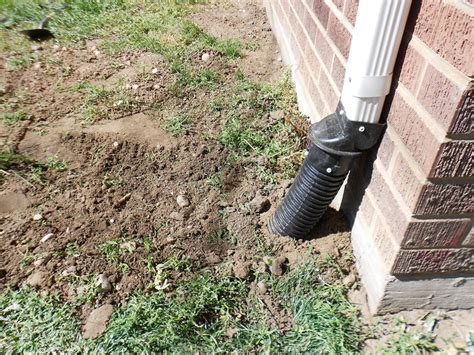 Learn how to properly set up and clean gutters and downspouts to manage water on your property. How to Bury a Gutter Downspout (With images) | Downspout ...