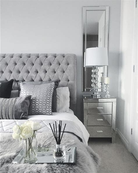 Master bedroom inspo bedroom goals black and white silver sheepskin rug mirrored bedside black table lamps. Grey bedroom inspo. Grey interior bedroom. Silver mirror ...