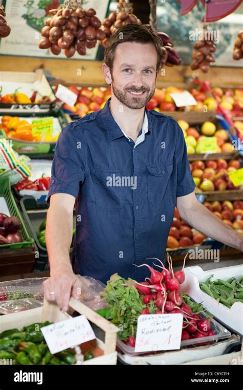 Man Smiling In Produce Stand Stock Photo Alamy
