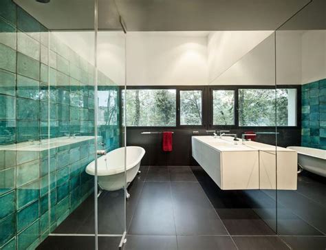 The bathroom tiles feature a stenciled design in a darker shade of grey to compliment the cabinets. Top 10 Tile Design Ideas for a Modern Bathroom for 2015