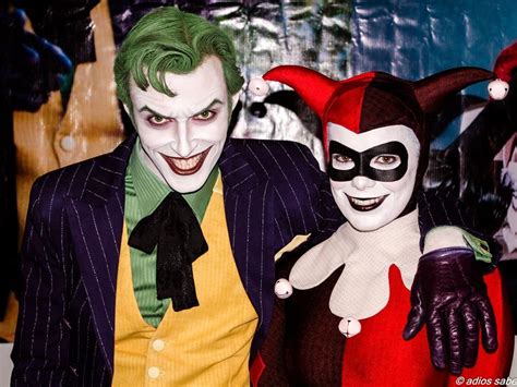 Two People Dressed Up As The Joker And Catwoman