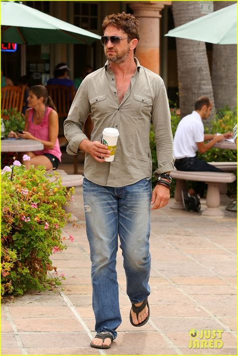 gerard butler scopes out surf gear after kissing session with mystery girl photo 3169585