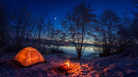 Illuminated Tent In The Winter Camp By The Lake At Night Stock Image