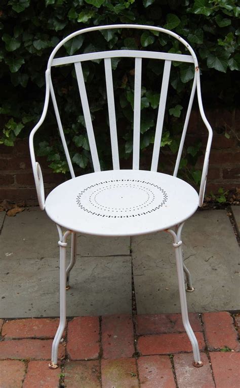 The hand applied white finish frame is crafted of fully welded cast aluminum. Set of Six Wrought Iron Outdoor Dining Chairs at 1stdibs