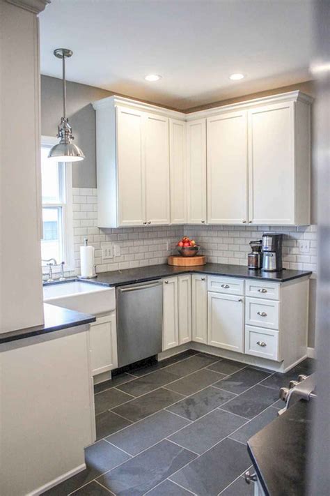 These chic, grey cabinets pair nicely with the farmhouse styled sink and subway tile backsplash. 70 Tile Floor Farmhouse Kitchen Decor Ideas (37 ...
