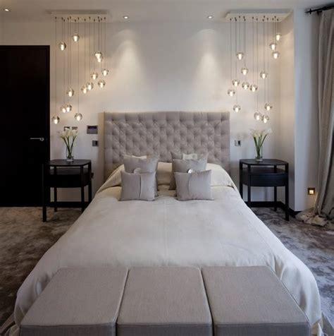 While designing and styling your bedroom, you need to keep a lot of things in mind accessories add the perfect finishing touch to bedroom designs. Warm grey bedroom with modern side chandeliers/pendant ...