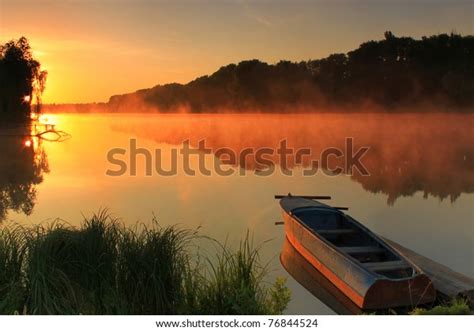 Boat On Shore Misty Lake On Stock Photo Edit Now 76844524