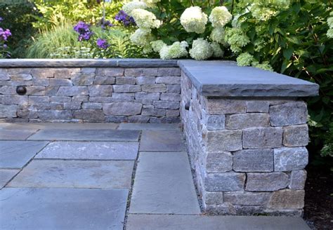 Just look to the old new england stone walls that we see along many of our country roads or in the woods. New England fieldstone veneer stone seat wall with ...