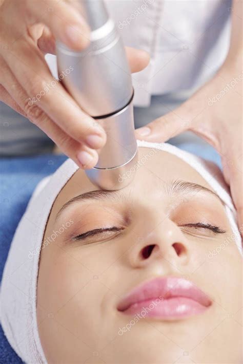 Cosmetologist Using Special Machine Giving Professional Skincare Female