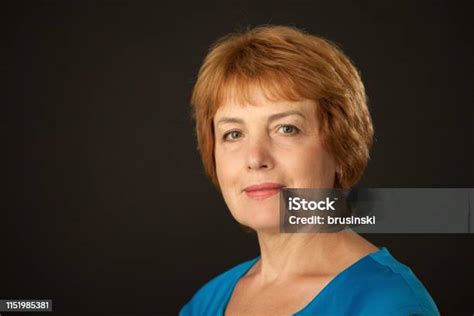 Studio Portrait Of An Attractive 60 Year Old Woman On A Black