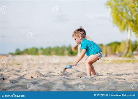 Little Boy Digging In The Sand On A Tropical Beach Royalty Free Stock