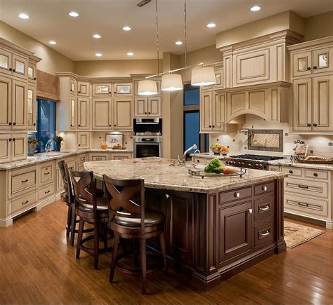 Let these color cues inspire new color for your cabinets. Light cabinets, dark island | Country kitchen cabinets ...