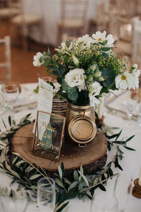 Beautiful lanterns, greenery, wood stumps + more. 21 Chic Rustic Wedding Centerpieces Ideas to Rock - ChicWedd