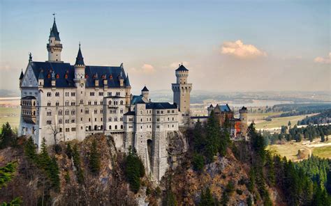 Adorable Side View Of The Neuschwanstein Castle During Sunset