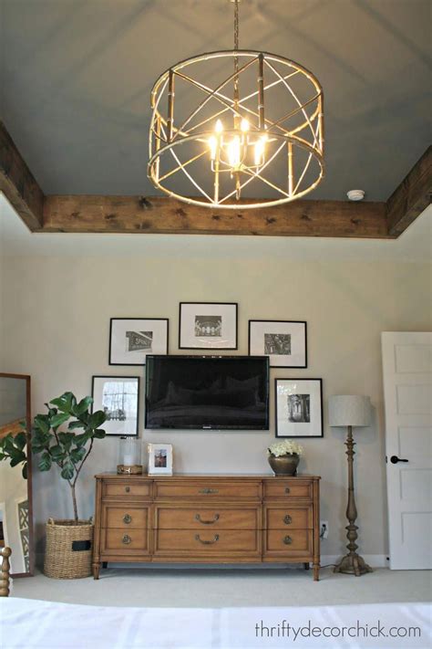 Guest bedroom decor guest bedrooms master bedroom master suite bedroom ideas ceiling design ceiling detail home builders home kat tanita of with love from kat shares interior decoration inspiration featuring lucite furniture, including lucite/acrylic coffee tables, chairs and trays. Cozy master with dark gray tray ceiling and wood beams # ...