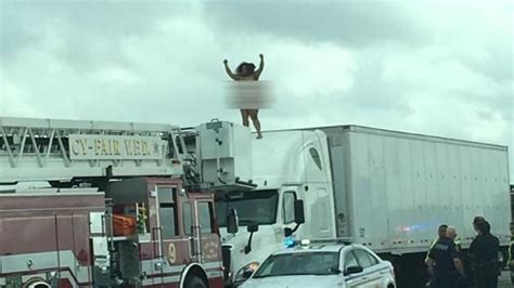 Naked Woman Climbs On Top Of Big Rig After Crash On Highway Page 1