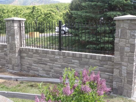 Combining Iron Aluminum Fence With Brick Stone Or Wood Pillars And