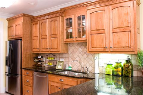 Stained wood cabinets have unique patterns and wood grains, so every kitchen will look a little different, even if the cabinet materials are the same. Alder Kitchens - Wood Hollow Cabinets