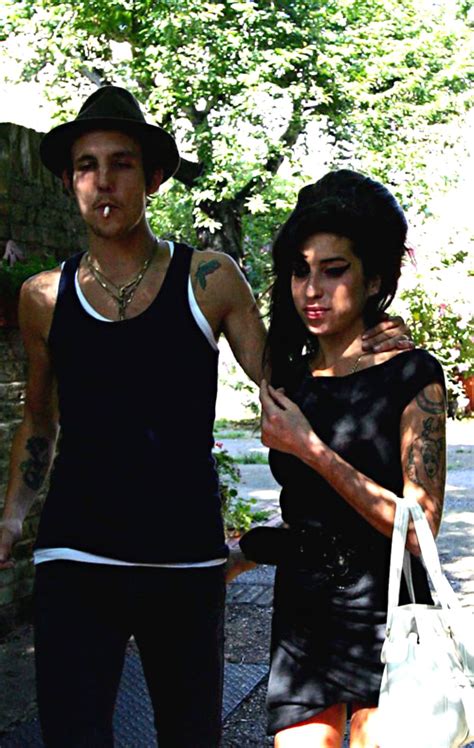 Singer amy winehouse has a drink between songs at the virgin festival at pimlico race course, in baltimore, maryland august 4, 2007. Amy Winehouse and her husband Blake out in London, July ...