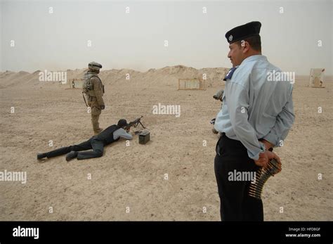 An Iraqi Police Officer Waits For His Turn During A Training Evaluation With The Us Armys