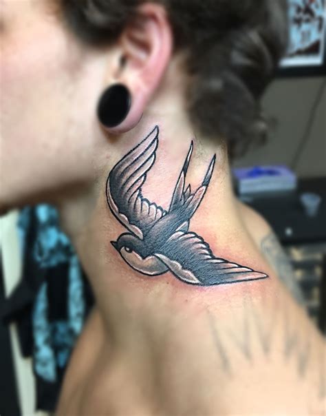 Although swallow tattoos may seem like a feminine tattoo design, the colorful birds are actually quite popular among men too. Traditional black and grey swallow neck tattoo | Neck ...