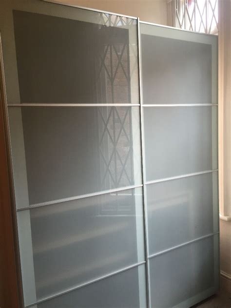 How to use standard ikea pax wardrobe frames and doors along with some extra timber framework to create that traditional custom fitted wardrobe look. Ikea PAX Wardrobe, white stained oak effect, frosted glass ...