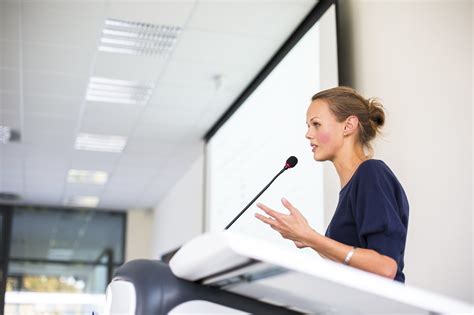 Pretty Young Business Woman Giving A Presentation In A Conferen Medecho