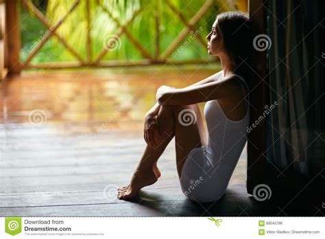 Sad Lonely Woman Sitting On The Porch During The Rain