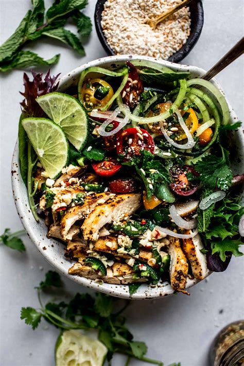 In a large bowl toss cabbage, carrots, chicken, cilantro and sesame seeds together. 20-Minute Thai Chicken Salad | Platings + Pairings