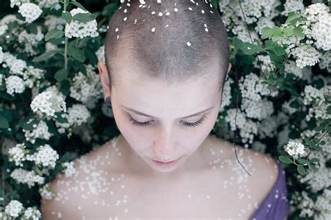 A Girl With A Shaved Head And Flowers Porerik Naumann