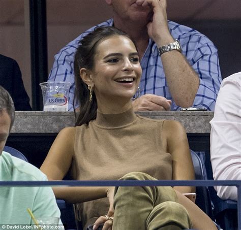 Emily Ratajkowski Shows Off Pert Derriere As She Sits In The Stands At