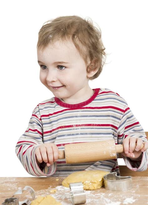 Happy Young Child With Rolling Pin In White Background Stock Image