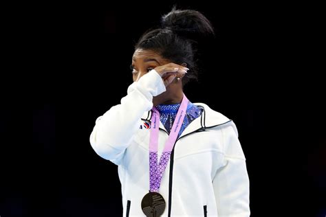 Simone Biles Gets Emotional During National Anthem After Becoming Most