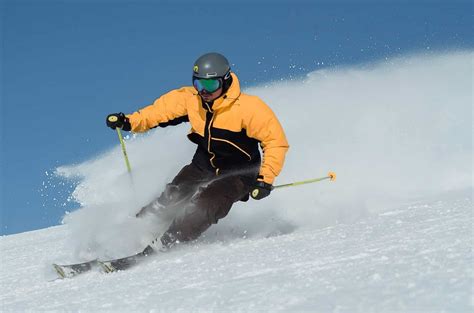 Man Skiing Whilst On Luxury Ski Holiday In Morzine Elevation Alps
