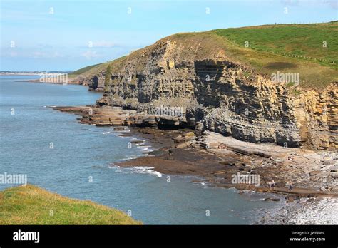 The Enormouse Rocky Cliffs At Southerndown On A Sunny Day Demonstrates