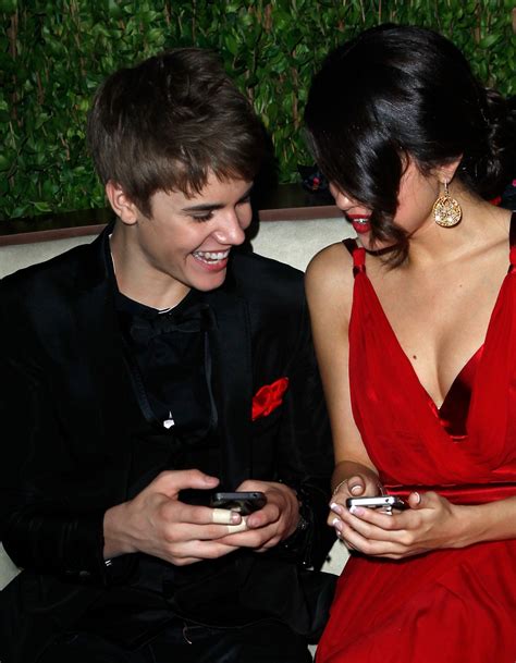 selena gomez and justin bieber photos showing them in love hellogiggles