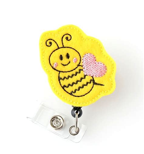 A female bee with fully developed reproductive organs. Queen Bee - Felt Name Badge Holders - Cute Badge Reels ...