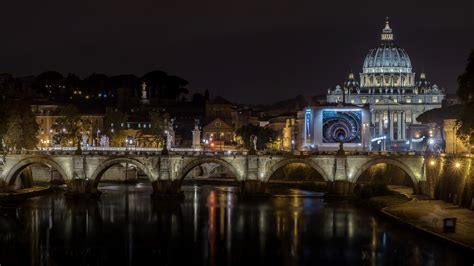The St Peters Basilica And The Bridge Of Angels At Night