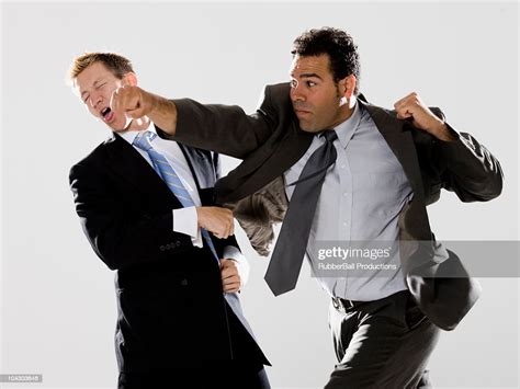 Two Businessmen Fighting High-Res Stock Photo - Getty Images