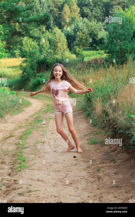 Beautiful Teen Girl Is Dancing Outside At Summer Sunset Stock Photo Alamy
