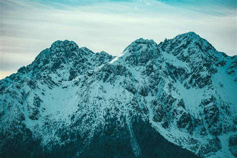 Photo Of Snow Capped Mountains During Daytime · Free Stock Photo