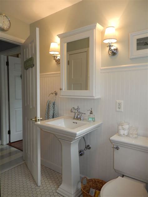 Your bathroom medicine cabinet is brimming with design potential—it just takes a little imagination. Beach Cottage bathroom - wainscoting, pedestal sink, wall ...