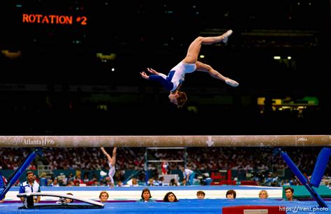 Strug overcomes pain to win gold in 1996. Kerri Strug on beam at Womens Team Gymnastics at the 1996 ...