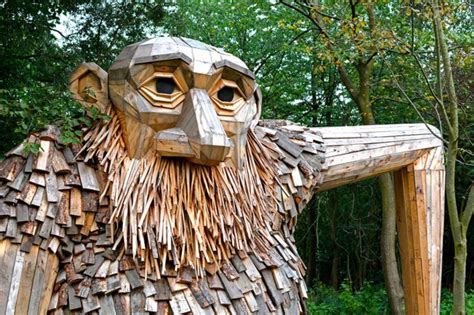 Artist Creates Wooden Giants And Hides Them In The Wilderness
