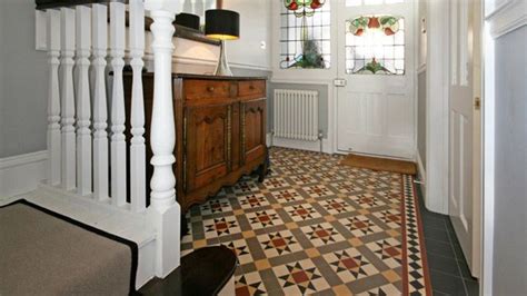 An Entryway With Stairs And Tiled Flooring