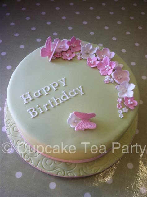 It's the people who make it a party! Flowers and butterfly birthday cake. www.cupcaketeaparty ...