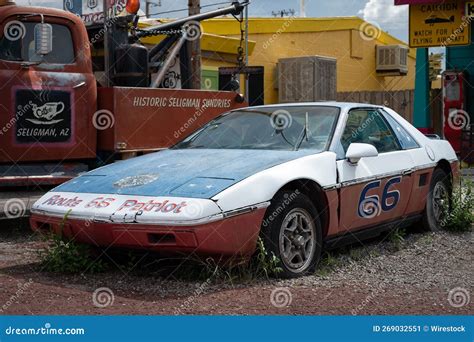 Close Up Shot Of An Old Painted Pontiac Fiero From Route 66 Abandoned