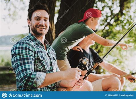 Sep 23, 2018 · aktuelle songs und noten für den gitarrenunterricht mit jugendlichen Young Man With Son And Father Fishing On River. Stock ...