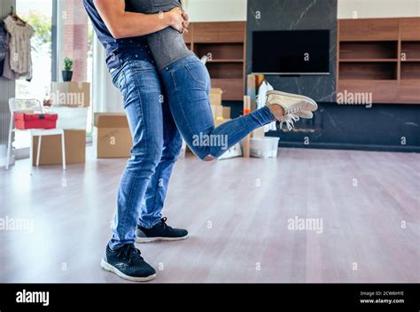 Couple Hugging In The Living Room Stock Photo Alamy